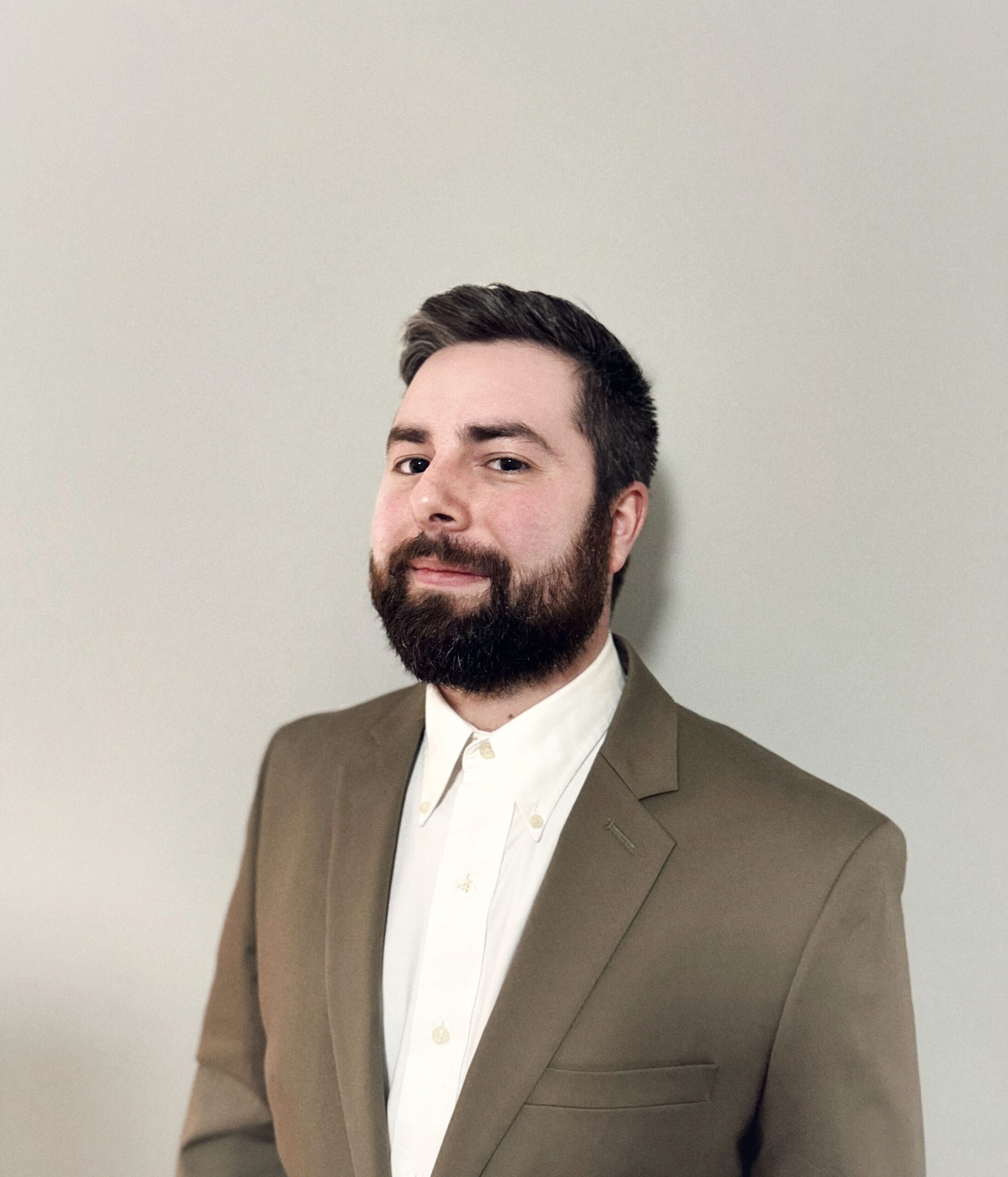 Man in brown suit jacket